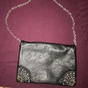Black , cross body bag, with studs on the sides